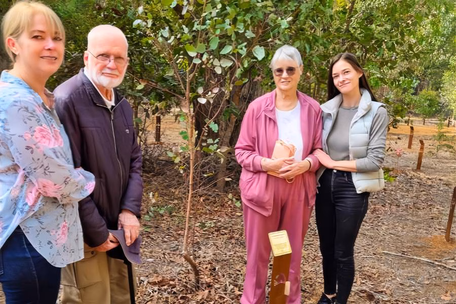 A family planting a memorial tree in Western Australia