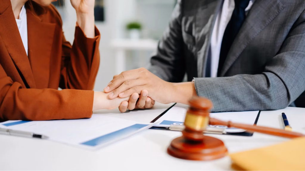 Person consulting a legal professional, symbolising regulations and permissions around scattering ashes.